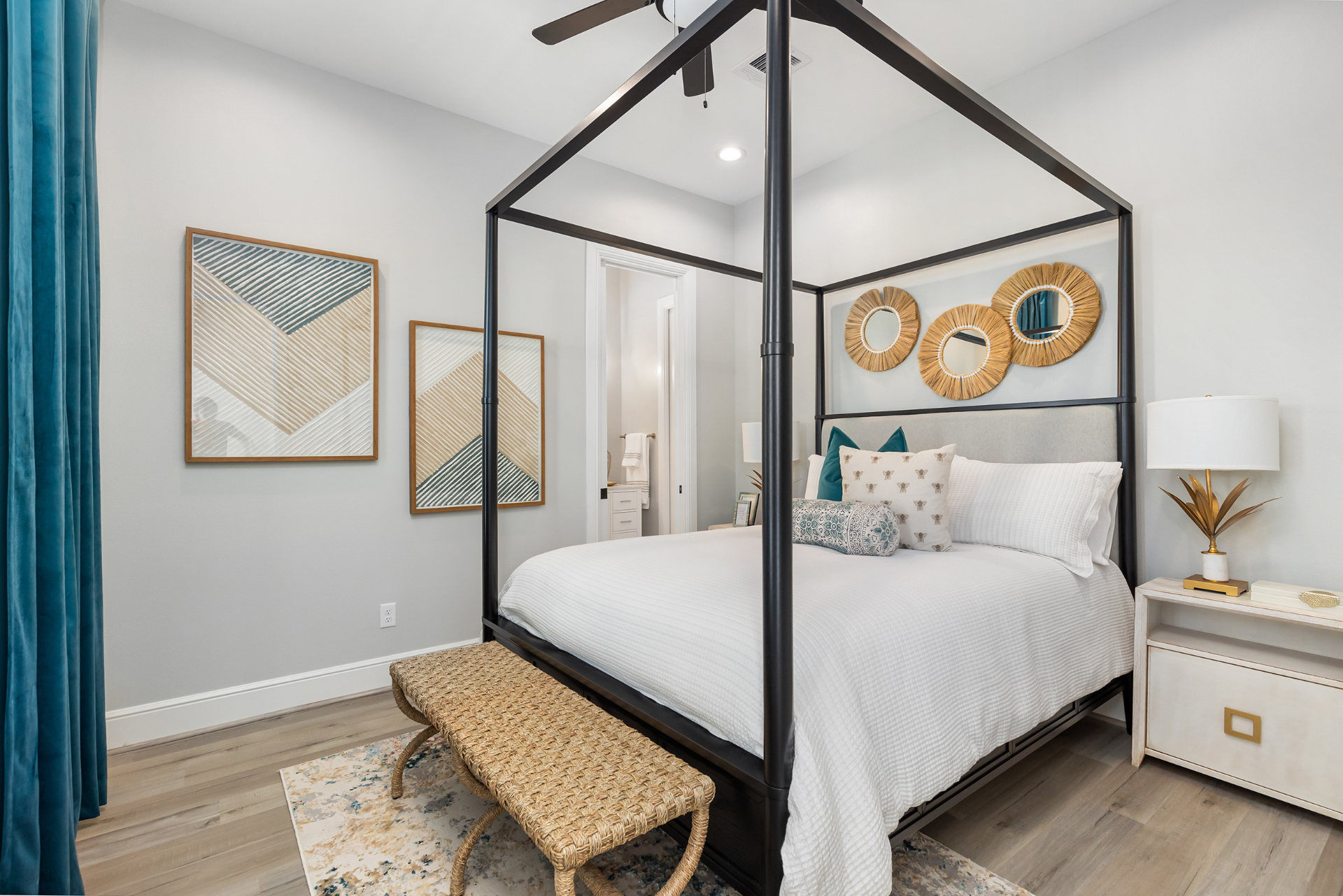Canopy bed guest room with coastal accents